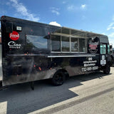 Black custom wrap BBQ food truck with open serving window – fully branded mobile catering truck for sale