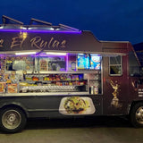 BBQ food truck operating at night with LED lights and fully open serving window – custom mobile catering truck for sale