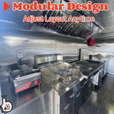 Commercial BBQ trailer kitchen with stainless steel walls, exhaust hood, grill, fryer, and fire suppression equipment