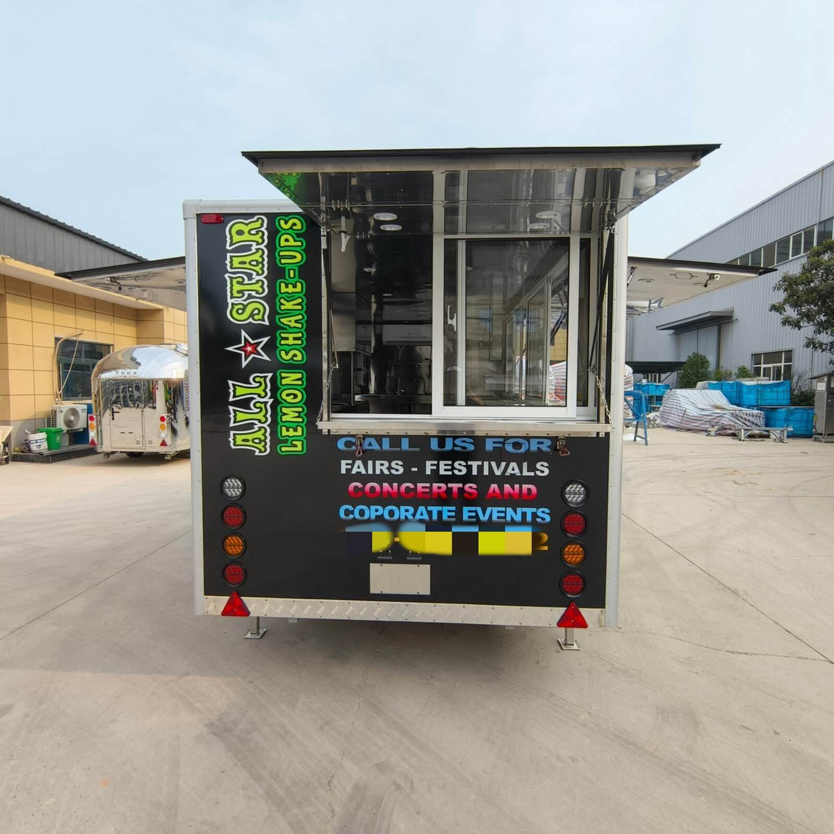 Rear service window opened on a custom beverage trailer showing interior pass-through access for efficient drink preparation