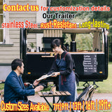 Coffee trailer owner serving customers with drinks and menu outside a mobile coffee business