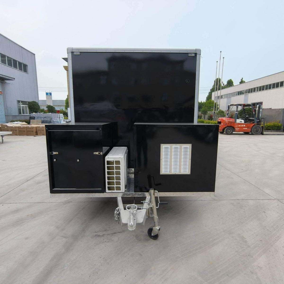 Commercial beverage trailer exterior with integrated generator compartments and air conditioning unit for mobile event operations