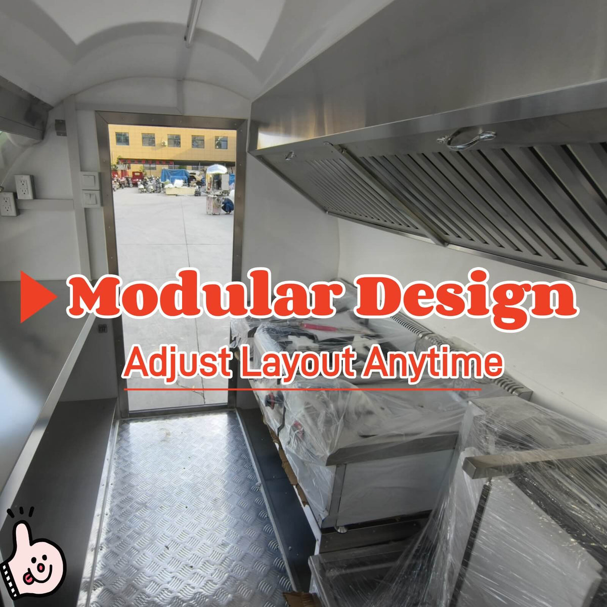 Commercial burger trailer kitchen interior with exhaust hood, fryer, and griddle