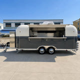 Custom Airstream food trailer side view open – full-length service counter dark grey cream finish by Isabella Trailer
