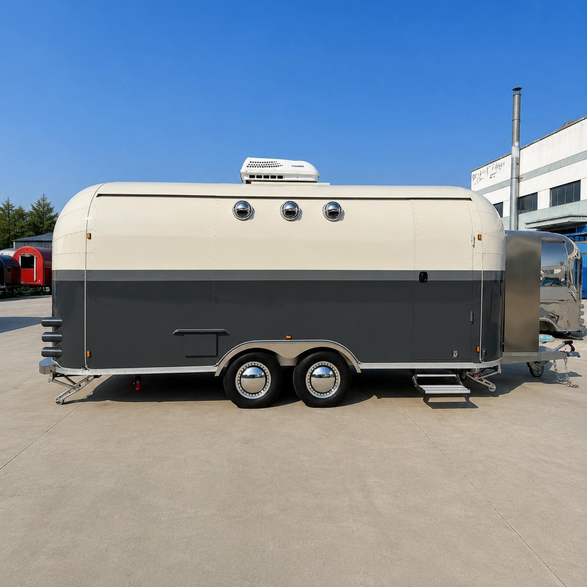 Custom Airstream food trailer front view – dark grey cream two-tone open service window dual axle by Isabella Trailer