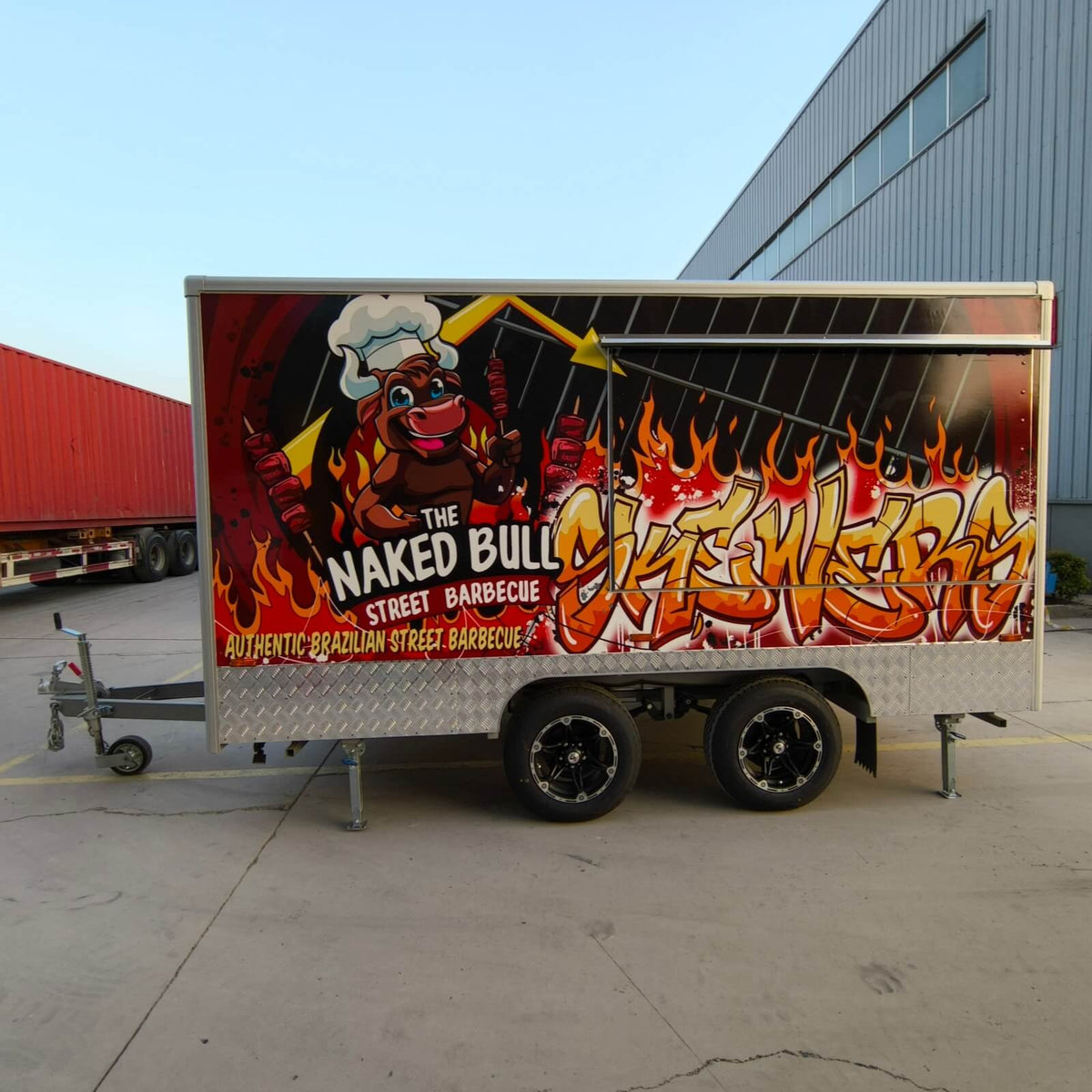 Side view of a custom BBQ concession trailer with a full exterior vinyl wrap and service window
