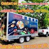 Custom food trailer being towed by a pickup truck on the road, featuring a full-body graphic wrap design and heavy-duty dual axle chassis.