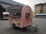 Custom pink rounded crepe trailer side view open – service window stainless counter single axle by Isabella Trailer