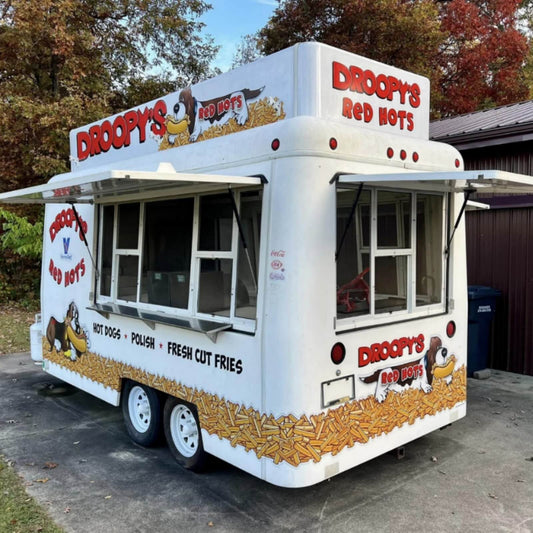 Custom square food trailer with open service windows – Droopy's Red Hots hot dogs and fries wrap by Isabella Trailer