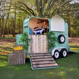 Green horse trailer converted to outdoor bar – wood ramp bartender serving drinks by Isabella Trailer