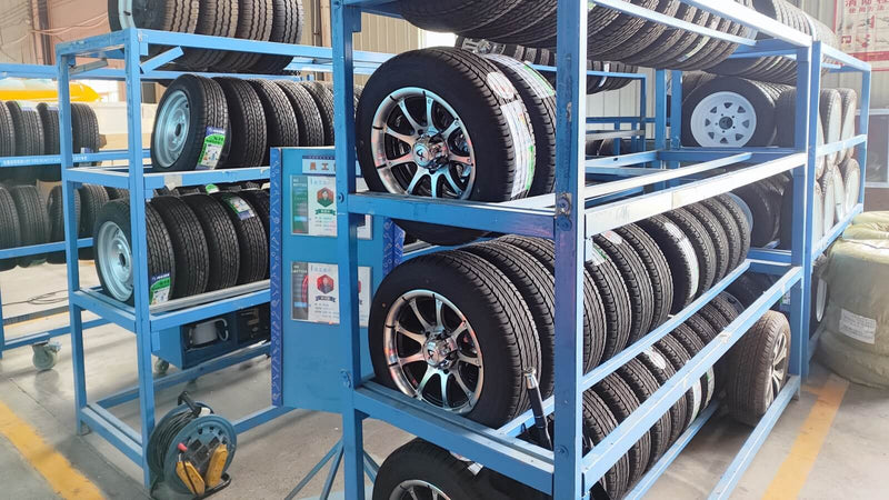Trailer tire and alloy wheel inventory rack at Isabella Trailer manufacturing facility