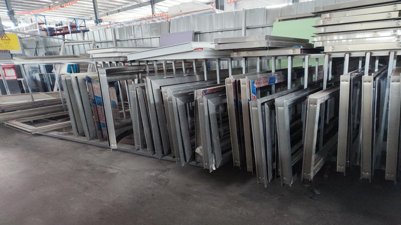 Stainless steel window and door frame components stored at Isabella Trailer factory
