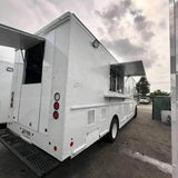 White step van Mexican food truck rear side view with serving window and awning fully open – large mobile catering truck for sale
