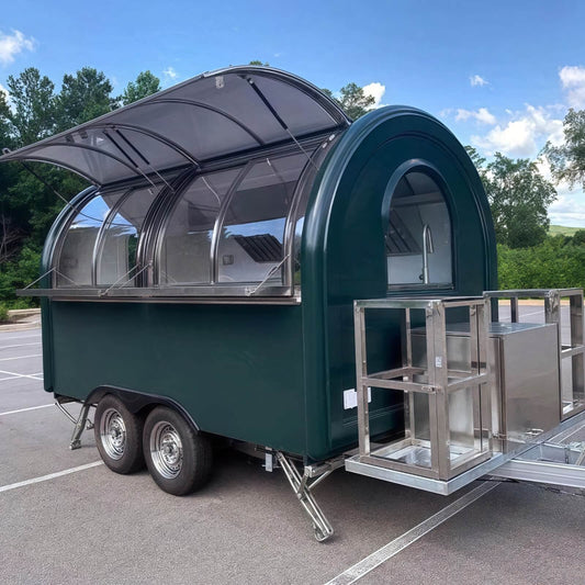 Front view of a rounded concession trailer featuring a curved tempered glass sliding service window.