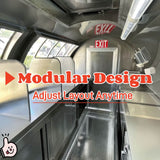 Interior view of a rounded concession trailer showcasing stainless steel countertops with modular dividers and a diamond plate floor