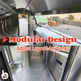 Interior view of a rounded concession trailer showing the stainless steel workbench and integrated under-counter refrigerator.