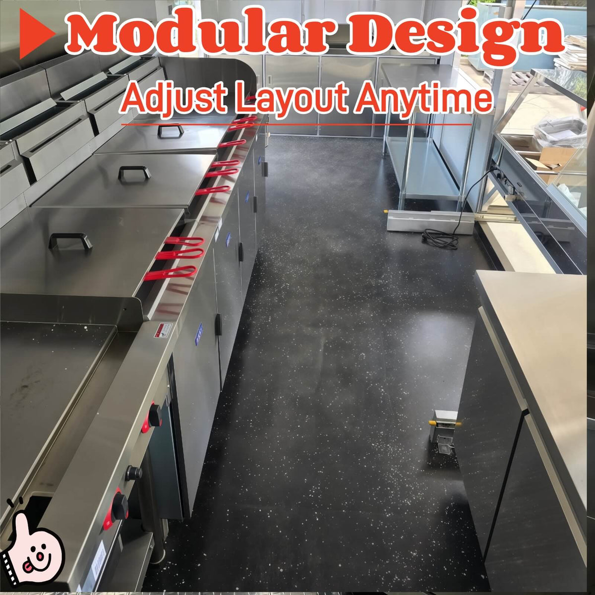 Interior view of a seafood concession trailer with three commercial fryers and stainless steel kitchen workspace