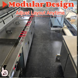 Interior view of a seafood concession trailer with three commercial fryers and stainless steel kitchen workspace