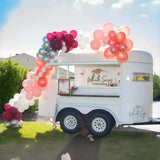 White horse trailer bar at outdoor event – balloon arch White Sage Mobile Bar Co branding by Isabella Trailer